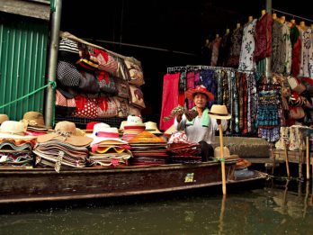 woman selling hats economic leakage tourism